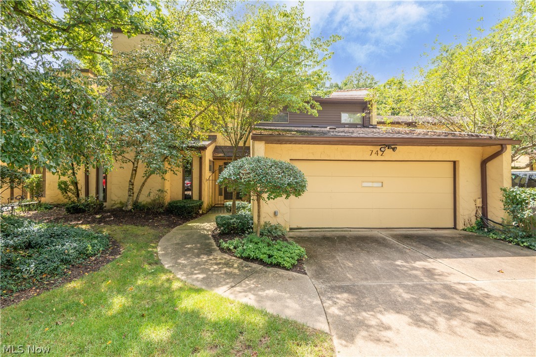Beautiful well maintained condo in desirable Hampton Ridge development. Prime location offers privacy and quiet with gorgeous wooded view from professionally hardscaped patio. Inviting foyer leads to carpeted living room with carpet, gas fireplace, slider to patio, and wet bar.Updated kitchen features beautiful cherry cabinetry, wood flooring and GE appliances, granite island with sink, corian countertops with additional sink.Cozy carpeted family room off the kitchen with gas fireplace. Formal dining room off of kitchen. First floor laundry room with utility sink and built in cabinets. Large luxury master suite with ensuite bathroom with skylight and two vanities with sinks. two large secondary bedrooms with carpet and large closets, one has ensuite bathroom. Office/sitting room/sewing room. Loads of storage throughout, with great natural light from many windows. Two car attached garage with built ins.