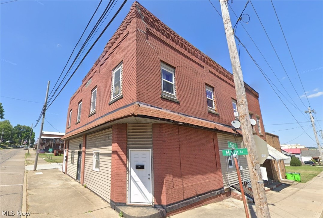 Rare 3 unit apartment building that has been extensively remodeled inside. All of the apartments contain 2 bedrooms/1 bathroom with 2 apartments on the second floor and 1 apartment on the ground floor. The second floor apartments are all electric with baseboard heating, the ground floor apartment has gas forced air furnace heating. Owner pays city water/sewer monthly billing at approximately $110-$120/month along with a trash dumpster on site at approximately $90/month, tenants pay all other utilities. Updates include roof, windows, electrical, plumbing, in addition to the interior of the apartments themselves. Plenty of remaining unfinished space on the ground floor to possibly construct paid tenant amenities such as extra storage areas or coin operated laundry. Property is zoned M3-Mixed Industrial. Please consult City of Rittman for zoning regulations and restrictions.