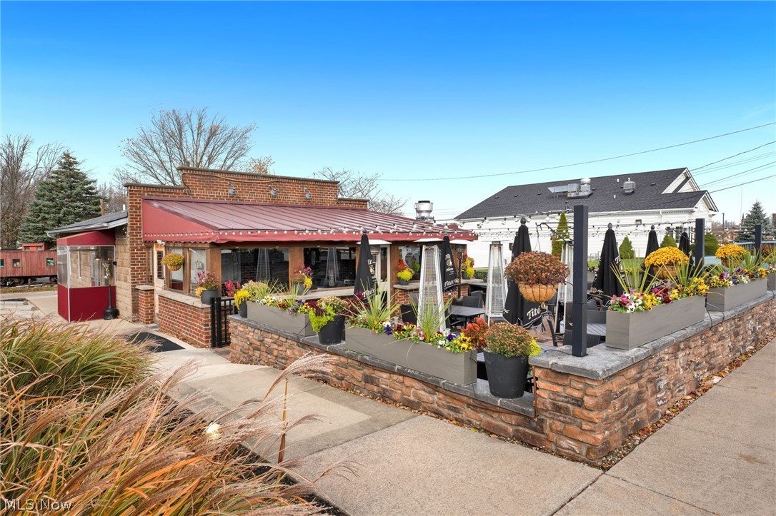 Discover an exceptional investment opportunity in the heart of Avon with this historic landmark property at 36816 Detroit Rd. This offering includes the building, land, and valuable liquor license rights, the business itself is not included, providing a rare chance to own a well-established restaurant and bar location in one of Avon’s most desirable commercial corridors. Fully rebuilt in 2006, the property features a fully loaded commercial kitchen, including a wood-stove pizza oven that stays with the building, along with a spacious dining area and patio perfect for seasonal service and high-traffic appeal. The property is currently leased to a long-term tenant who has been operating here since 2017 and is locked in for two more years with two additional extension options that could carry occupancy through 2037. This reliable tenant covers all taxes and utilities, making this a low-maintenance, high-return investment. With its prime location, strong rental history, modern rebuild, and historic Avon designation, this property stands as a standout commercial opportunity offering stability, character, and immediate cash flow.