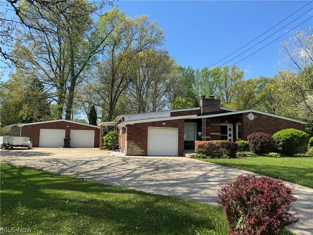 Welcome to this 4 Bedroom Brick Ranch Home in Austintown with 2 full bathrooms. Located just minutes away from dining, shopping, schools and parks. Kitchen with appliances, new linoleum with plenty of cabinets and a pantry. Dining Room has sliding doors going out to the 24x20 sunroom with plenty of windows, Natural stone flooring, wood stove, and hot tub for relaxation. Living room has a cozy gas fireplace with large picture window. Basement has an extra 5th bedroom with a closet. Full bathroom, Glass blocks windows. Roof 2019, furnace 2003, hot water tank 2022. This home has one car attached garage plus 24x24 Detached garage with concrete flooring, 50 amp service and 220 V. Nice size yard. Side door wood deck with awning. Selling as is. Make your appointment today.