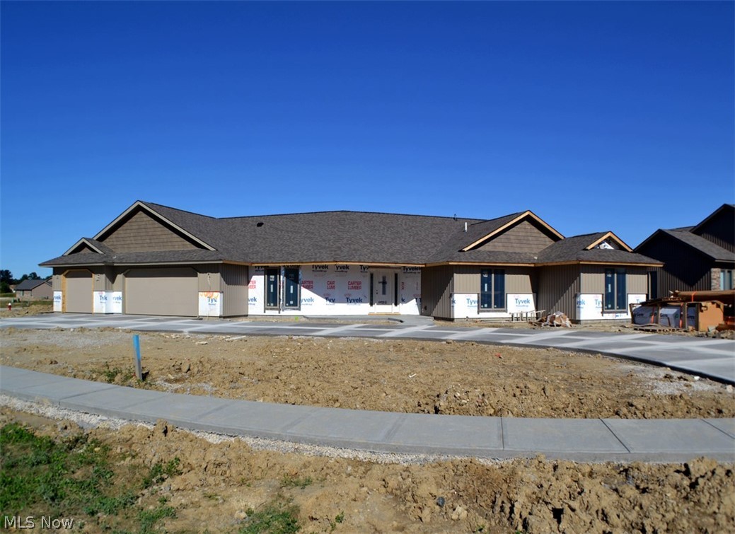 Home is under construction. This fantastic custom-built cluster home features a spacious grand room with vaulted ceiling and large dining area, wonderful kitchen with custom cabinets, granite counter tops, tile backsplash, snack bar island, walk-in pantry and skylight, three spacious bedrooms - master suite with full bath with granite top vanity, walk-in shower, and spacious dressing room with custom wardrobe chests, office with cathedral ceiling, mud room, large laundry room, fantastic 35' x 13' hobby/rec room  with tray ceiling, covered rear porch, upgraded lighting and plumbing, spacious three car garage with hot and cold water, full drain, door operators, pegboard and pull-down stairs to overhead storage.  Subdivision clubhouse, fitness center, Olympic-size pool, children's pool and play area.  Numerous single family and cluster home building sites are available.