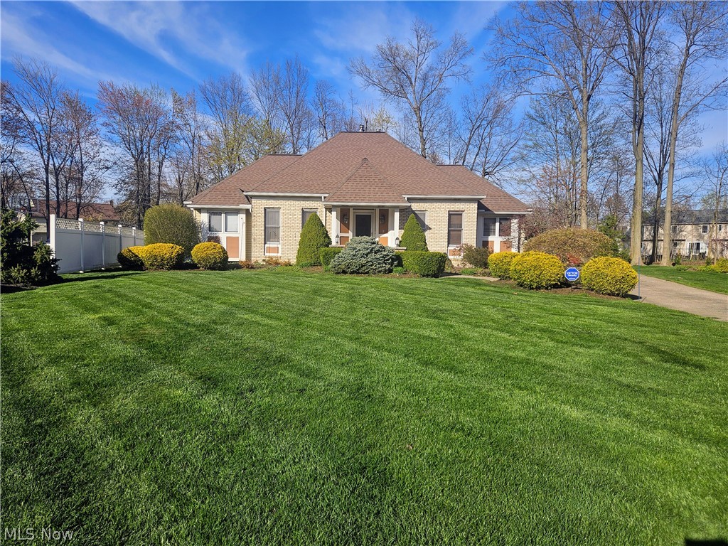 Rare opportunity!! Nearly 2800 sq ft with another additional 1300 sq ft in the finished lower level for total of 4100 sq ft finished living area. Features 4 bdrms and 3 1/2 baths. This home includes 1st floor owners suite with walk-in closet and glamour bath. Also, a 2nd bedroom on the 1st floor. Bedrooms 3 & 4 up with full bath. Lower level rec room and full bath. Also included in lower level is a kids play room or computer/gaming room and a storage area. The main level offers a open floor plan with beautiful details. Eat-in kitchen with wood floor and granite counter tops and all appliances. Also, kitchen island with spacious breakfast bar. Family room with a detailed wood/coffered ceiling and stone fireplace/wood burner and built-in cabinets along with wood flooring. 1st floor Office/Den (or even a 5th bedroom if needed) with wood flooring and beautiful built-ins. Dining room with wood flooring, laundry room and 1/2 bath complete the 1st level. Spacious 2 car side load garage. Shed offers plenty of storage along with a wood shelter. Front covered porch. Private brick paver patio over looks the backyard. Nestled on nearly 3/4 of an acre and sits on a cul-de-sac lot. This home offers so many great features so don't miss it!!!