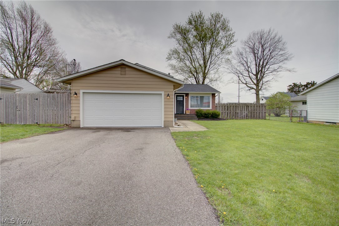 This beautiful Grafton home in the Midview School District is so well cared for, you won't have to do anything but move in! Many of the big ticket items have been completed, some of which include the roof in 2021, windows in 2020, gutters with gutter guards in 2021, many of the interior doors were replaced, and the front and sliding door were done in 2021. The main level has new LVT flooring, tasteful lighting and a neutral color palette in the living, dining and kitchen areas. The kitchen includes black stainless steel appliances, new countertops, a timeless white backsplash and a recently built pantry. The bedrooms are generous in size upstairs where the primary suite comes with built-in shelves, an accent wall with shiplap and entry to the shared full bath that was refinished in 2023. On the lower level you'll find a family room, den and recently refinished full bath. A new wood burning fireplace sits below a lovely mantel on painted brick and is adjacent to a den area which, in the past, was enclosed and doubled as a bedroom. There is an unfinished basement in the level below the family room that currently houses the laundry, mechanicals and plenty of storage space, but could be easily finished for additional living space. In 2023 the garage door and garage door opener were both replaced, AND speaking of the garage...Though it functions as both a place to park and put your tools, it has certainly been upgraded to "man cave" status!  There is a huge ceiling fan, beautiful epoxy floors, a new man door and a decorative wall with a TV for game days.  And if you want to get outdoors, you can enjoy the new 20x20 concrete patio with a firepit and a fully fenced in yard. This home is well-maintained, clean, charming, cozy, and ready for someone to love and enjoy.