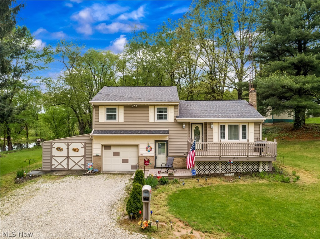Welcome to this incredible, one owner home situated on over half an acre.  Located in Manchester School District and just minutes to Portage Lakes, shopping and restaurants, yet seems like you are miles away from it all. Three bedrooms and full bathroom complete the upper level, first level has a large eat in kitchen and living room, off the kitchen is a door to the spacious backyard where there are beautiful gardens and seating area.  A couple steps down is the mudroom/utility room where the washer and dryer is located with plenty of room to greet your guests or for extra storage room for coats, shoes etc.  Lower level has a finished rec room.  Some updates include: roof 2018; Furnace/ac 2007; siding, shutters, deck within past 10 years.  Schedule your private showing today, this home will not last long!