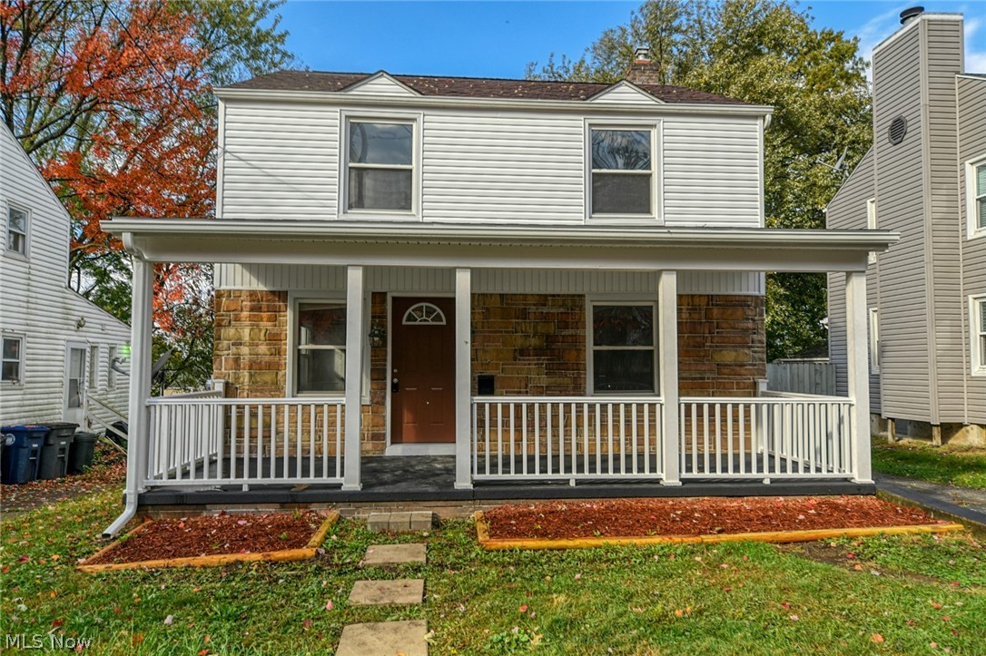Stunning Firestone Park remodel! This traditional Akron colonial now fits a current buyers needs. The open floor plan connects the massive living room to the formal dining room. It flows nicely right through to the all new kitchen and wonderful bonus room! A convenient half bathroom has been added and is brand new on the main floor with ceramic flooring. Rustic wood look laminate flooring runs through the main level. The kitchen offers classic white cabinetry, marble look counter tops and brushed bronze hardware that ties into the wood topped breakfast bar island! The bonus room on the main floor has endless possibilities and can be used as an office, a play room, or an additional family room! Upstairs you will see all brand new carpet that runs through each bedroom. The 3 bedrooms upstairs are a great size that offer nice closet space! The upstairs bathroom has a new vanity and ceramic flooring.  Step outside to a freshly painted deck and notice the fresh new landscaping and lighting,