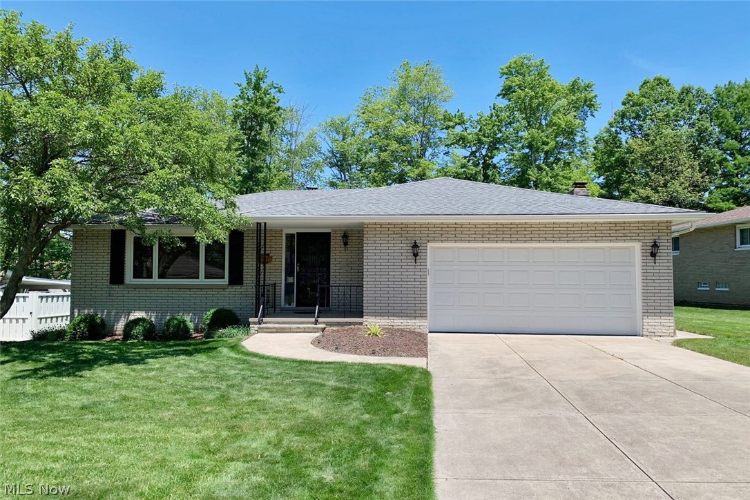 Welcome home to this lovely ranch style home situated close to everything you need in Parma! This home features a beautiful eat-in kitchen, a spacious family room, and a great backyard. The living room is illuminated by a picture window and is open to the formal dining room. You are sure to love the eat-in kitchen, which boasts a full complement of stainless steel appliances and ample cabinetry. The spacious step-down family room features a stone fireplace and patio access, perfect for entertaining. Three large bedrooms, including the master bedroom with an en suite half bath, and a full bathroom complete the main level. The lower level is partially finished and includes a family/media room, a rec room, a convenient laundry area, and plenty of storage space, plus a bonus stove and freezer. Outside, you are sure to enjoy relaxing on the back patio, which features a hot tub and overlooks a lovely backyard. Located between State Road and Ridge Road, this home is just minutes away from The