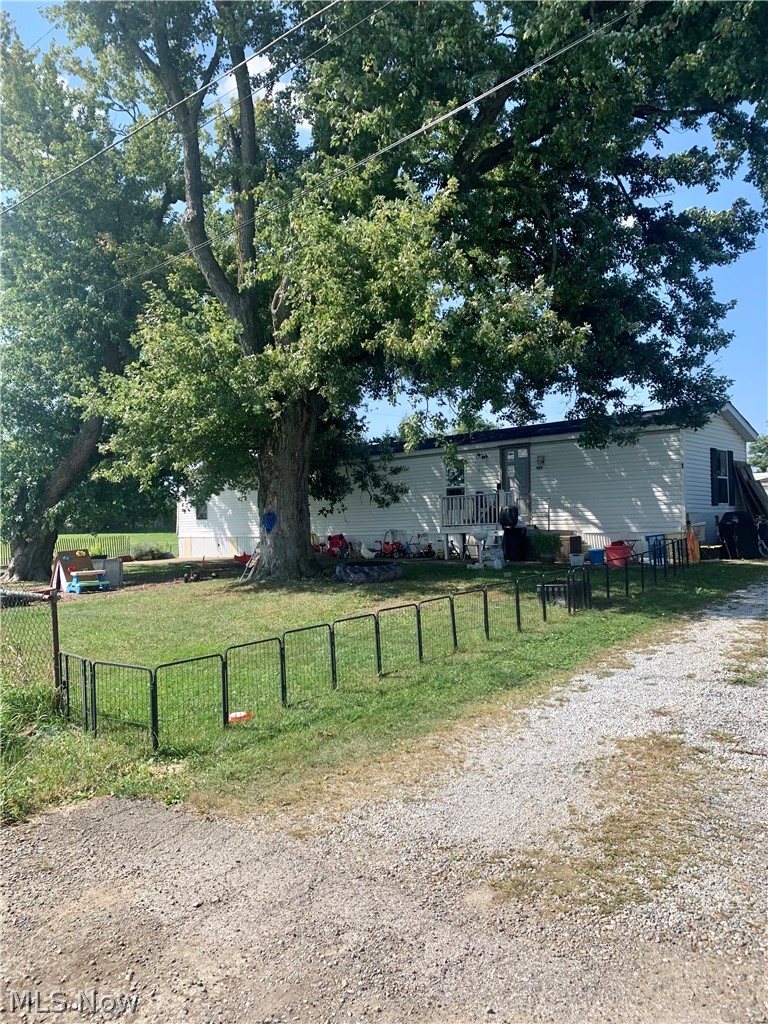 Investor opportunity you don't want to miss! This income-producing property features a small trailer park with 4 mobile homes plus a single-family home,  with long-term tenants in place. Currently generating $3,200 per month in rental income, this property offers immediate cash flow and strong investment potential. Whether you're looking to expand your portfolio or step into rental property ownership, this is an opportunity with consistent returns. Schedule your showing today!