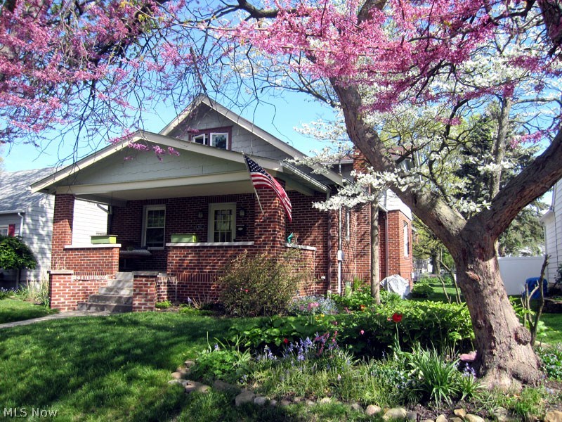 This is a must see home.  Craftsman bungalow with 4 bedrooms, beautiful hardwood floors, windows have all been replaced, plus glass block in the basement.  Wiring updated with new service box 150 amps.  New granite counter in kitchen.  First floor bedroom updated with bamboo floors and new fixtures.  Second floor gutted and remodeled in 2008.  Uniblock paver patio installed in 2005.  Enjoy this eclectic neighborhood and all the amenities Cuyahoga Falls has to offer.