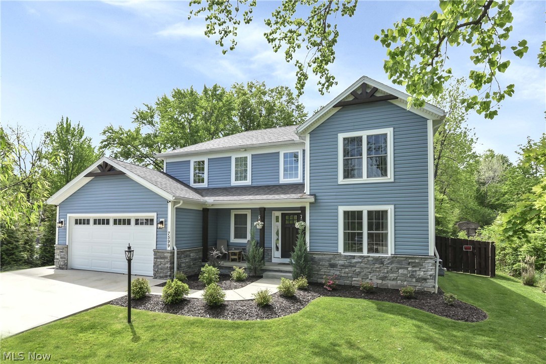 Contemporary colonial home shows like a model.  Only 5 yrs young!  Enter into 2 story foyer
 leading to beautiful dining room featuring built-in buffet cabinetry, tray ceiling and
 built-in wine rack.

Stunning 2 story great room features wood burning fireplace w/stone facing, wood mantel and trapezoid windows.

Charming Kitchen with island features spacious Merillat cabinets, walk-in pantry, plank flooring and stainless steel appliance package. Walk out to patio from kitchen. Enjoy the private patio and amazing wooded backyard view. Beautiful, picturesque back yard - over one acre lot!!  Fenced yard and backyard pathways. 

Master Bedroom Suite and bath with double sinks, linen closet, soaking tub. Walk-in closet, closet organizer and custom shelving. Three additional bedrooms have ceiling fans/built-in custom shelving. 1st floor bedroom can be office/flex space.

First floor laundry room w/storage cabinets & closet, tiled backsplash and butcher block counter.

The 13-course basement has plumbing rough in for bathroom / glass block windows.
Home contains Pella double-hung windows. Therma Tru front door with window.
Close to shopping, library, freeway & Metro Parks. North Royalton schools. Do not miss this unique well maintained home! Move-in ready!