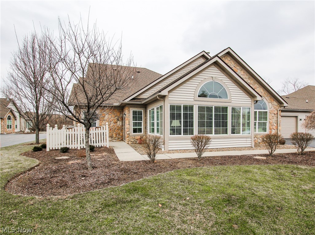 This spacious cluster ranch condo located at Crossings of West Valley offers one-floor, low-maintenance living! The large great room has vaulted ceilings and lots of natural light which highlights the home’s very open floor plan. Catch a sunset from the relaxing sunroom just off the great room. The kitchen is open to the dining area and great room. The two generously sized bedrooms each have a large walk-in closet that provides plenty of storage and spacious bathrooms.  The owner has taken great care and it shows! This is a must see! Crossings of West Valley also has a community center that offers pool tables, renting options, workout room and a pool!