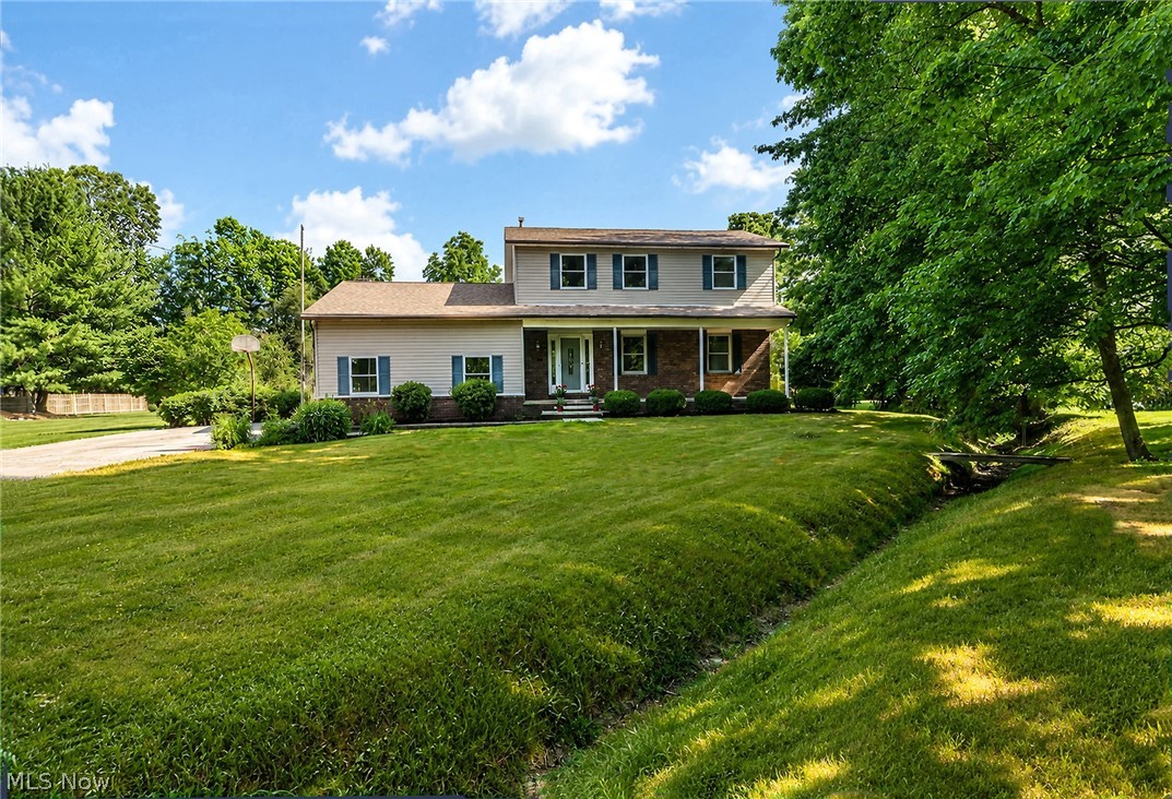 If you’ve been looking for the right Wadsworth property to create your family’s homestead, this will be the one. Loaded with cherished memories, this lovely 4 bedroom, 2.5 bath colonial has been in the same family for nearly 50 years. With a perfect blend of modern updates and country charm, the property features expansive front and back yards, on two parcels, with plenty of space to relax and enjoy the outdoors ... all on a street with just the right amount of homes. With a perfect combination of lovely hardwood flooring, new carpet and paint throughout, you can move in with comfort. The kitchen is large enough for the cook and a couple of helpers too. The appliances were carefully chosen, including a dual-fuel range for the discriminating cook, featuring a gas top and electric oven. All of the bathrooms have been expertly remodeled, with beautiful fixtures and finishes and there’s even a jacuzzi tub in the mix! The lovely family room opens to a lower screened in porch with skylights. If you’ve always envisioned your property as being one where generations can pick fruit right off the branches, this property has 2 peach trees, a pear tree and an apricot tree, and there are even grapes and asparagus growing in the back of the property. If you work on cars or have a seasonal vehicle or an RV you store, there is a huge 24x40 barn/outbuilding with concrete floor, electric and natural gas. There are walking trails and a bridge with two 7” wide beams on either side that you can actually drive across if you want. Improvements over time include the roof, HVAC system, Pella windows, appliances and more. Add the highly sought-after Wadsworth Schools with strong curriculums and sports programs, plus 20 community parks including Blue Tip Park, with everything from play structures, tennis courts, a spacious pavilion and stand-out special needs features designed to include everyone. All this, plus being conveniently located to Route 57 and I-76, and this one is a sure winner!