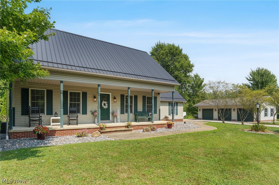 Welcome home! This updated cape cod with first floor primary suite sits on over 2 acres in Northwestern School District. Recent updates include metal roof (2022), ac and furnace(2024), and a backyard makeover(2023). The detached garage is a dream, at 40x24' with 3 garage bays, electric and insulated walls. The backyard is amazing, complete with stamped concrete patio, pergola, hot tub (negotiable), and fire pit over looking your private backyard. There is also a full, unfinished basement great for storage or to add future additional living space. This house truly has it all, time to schedule a private tour to appreciate all this home offers!
