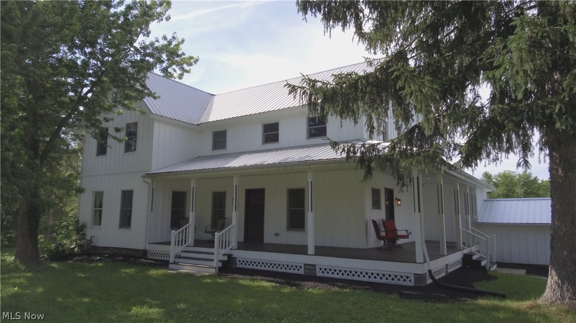 Welcome home to this beautifully renovated farm house on 4+ acres, located at 8230 Kinsman Road in Novelty, Ohio.  This spacious century home boasts an open floor plan with over 3000 square feet of living space, 4 bedrooms including a large master suite with a walk-in closet, bathroom with dual sinks, tub and beautiful ceramic tile shower. There is also a guest master suite with a large bathroom featuring dual sinks, and second floor laundry down the hall.
The first floor shows off all new hardwood floors throughout; a large kitchen with Kraftmaid cabinets with slow-close drawers, a deep copper farm sink, gorgeous granite countertops, white subway tile backsplash, stainless steel GE cooktop, double ovens, dishwasher, Frigidaire professional series refrigerator and freezer.  This home also features 2 built-in wine refrigerators, ventless gas fireplace and heated towel racks in both full bathrooms.  Exterior amenities include  a 3000+ square foot bank barn, over 4 acres of land, a large