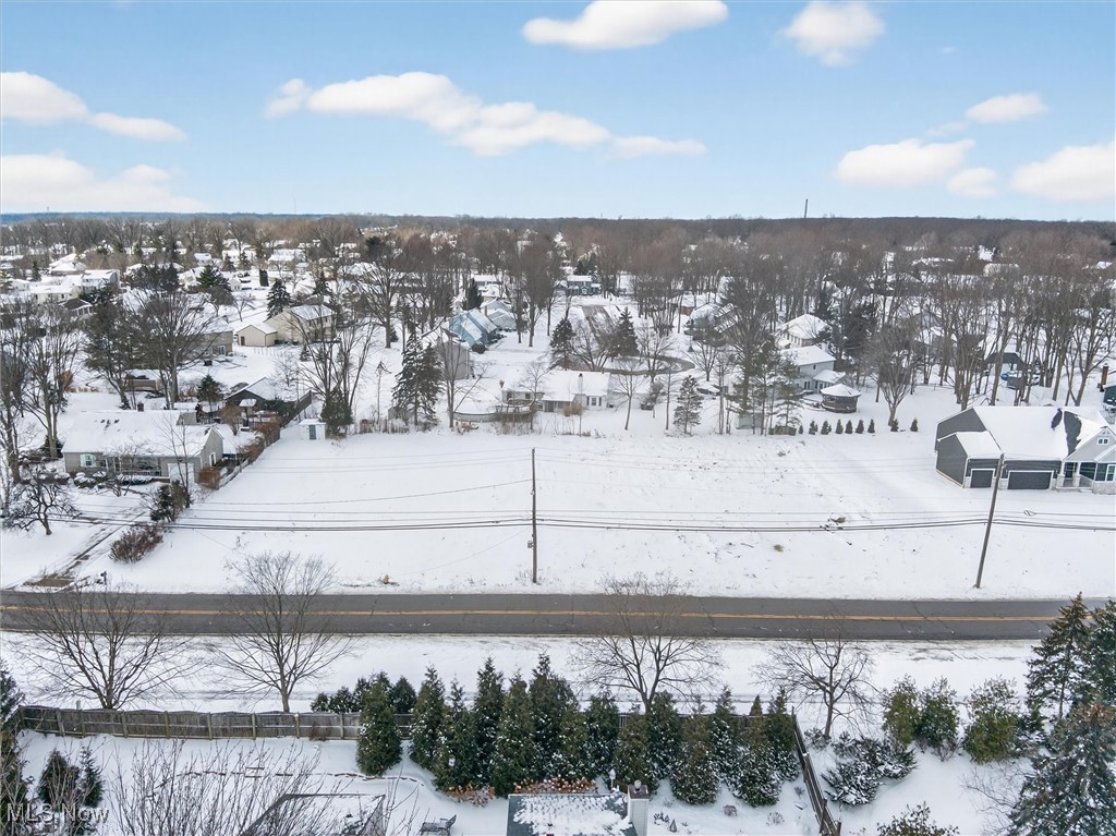 Welcome to a rare opportunity to build your dream home on this 0.35-acre buildable lot in desirable Avon Lake. The adjacent parcel also available for sale by the same owner, providing flexibility for a larger estate or multiple build options. Cleared, this parcel offers public water and sewer, neighborhood views, and convenient access to local amenities, schools, shopping, dining, and close to Lake Erie. Buyer to perform their own due diligence regarding utility connections and site preparation. Topographical survey already completed helping streamline the building process. No homeowners association, giving you flexibility in planning your custom residence. Close to major roadways for easy commuting while still enjoying the charm of a well-established community. Don’t miss your chance!