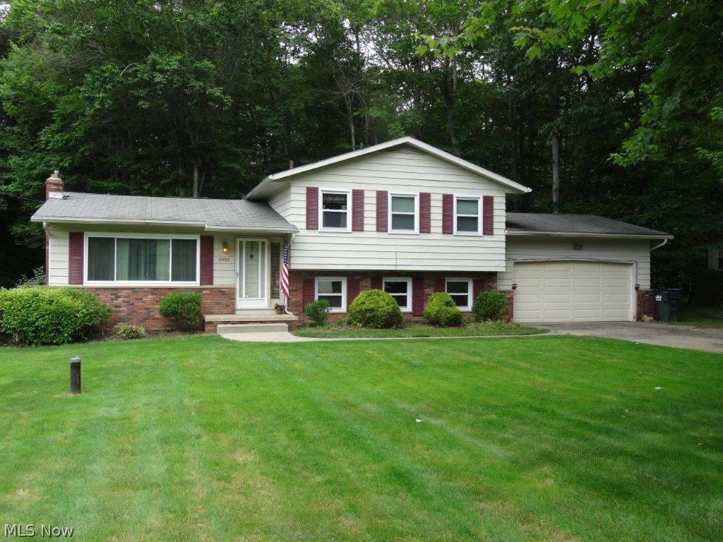 Extremely well maintained home in the desirable Highpoint Acres allotment.  You will love this spacious split, the main floor features a bright living room, formal dining room, functional kitchen with all appliances and eating area.  Upstairs you will find hardwood flooring in 3 good sized bedrooms, 2 full baths (one upper, one lower), lower level rec room + office.  Major updates include: central air 2014, Carrier furnace, and windows!  2 car attached garage, and extra storage in basement w/laundry area (washer/dryer are included). Nice private wooded yard with deck, quiet no-outlet neighborhood.