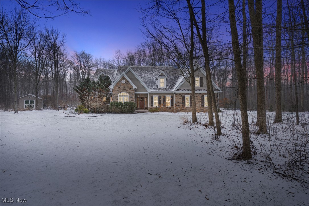 Step into an impeccably maintained home in Geauga County, nestled on 3.01 acres, and only 5 miles from the heart of Chagrin Falls. Fresh paint and refined finishes elevate every room. The kitchen features a ceramic backsplash with metallic accents, custom range hood, GE Café range 2023, dishwasher 2024, granite counters, and updated lighting. The open concept living includes an integrated Sonos system, hard wood floors, a powder room, office/bonus room and laundry room. This first-floor primary suite has an elegantly appointed ensuite with California Closets 2024, and designer lighting.  An ideal second level layout has three additional bedrooms, a full bath, a spacious loft, and a versatile bonus room. Every space has been thoughtfully updated to deliver comfort, style, and modern functionality. The lower level is the reason why you won’t be able to walk away from this home. Offering custom built-ins, an Art Deco inspired wet bar with marble tile and brass accents, quartz counters, beverage center, wine storage, electric fireplace with Italian glazed surround, LVP flooring, workout zone, hidden workshop room, and a multi-purpose room with Murphy bed. A beautifully finished ¾ bath with Japanese picket tile completes the space. The exterior impresses with curated landscape lighting, an arborvitae lined drive that was resurfaced in November, raised garden beds, a fire pit zone, and a custom 14×14 screened in vaulted porch with porcelain tile with private access from the primary suite or patio. A matching 12×16 storage shed, custom 2024 play set complete the outdoor amenities. Mechanical updates: gutter guards, a 2019 sump pump with dual battery backups, new water softener 2024, tankless water heater 2023. This home blends thoughtful upgrades, luxury touches, and flexible living areas while enjoying your wooded protected wetlands that are home to wildlife galore! Convenient access to highways and all necessary amenities. 
________________________________________