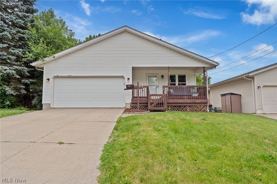 Welcome home to this beautifully maintained ranch in Barberton! From the moment you step inside, you'll appreciate the soaring vaulted ceilings and abundance of natural light that create an open, inviting atmosphere. Gorgeous hardwood flooring flows throughout much of the main level. The spacious living room offers plenty of room for entertaining guests or simply relaxing at the end of the day. The kitchen is both functional and charming, featuring an eat-in area with a wraparound bench that maximizes space and comfort. You'll love the ample storage, vaulted ceiling, and the convenience of all appliances staying with the home.
The main floor includes three comfortable bedrooms and two full bathrooms, providing easy one-level living. The finished lower level adds even more versatile living space with a large family room, game room, or a combination of both—tailor it to fit your lifestyle. An additional full bathroom downstairs adds convenience and flexibility. Step outside to enjoy the fenced backyard, perfect for pets, play, or outdoor gatherings. A large deck, conveniently accessed from the garage, overlooks the generous yard and offers the ideal space for grilling and entertaining. This move-in-ready home is waiting for its new owner—pack your bags and start enjoying all it has to offer!

I