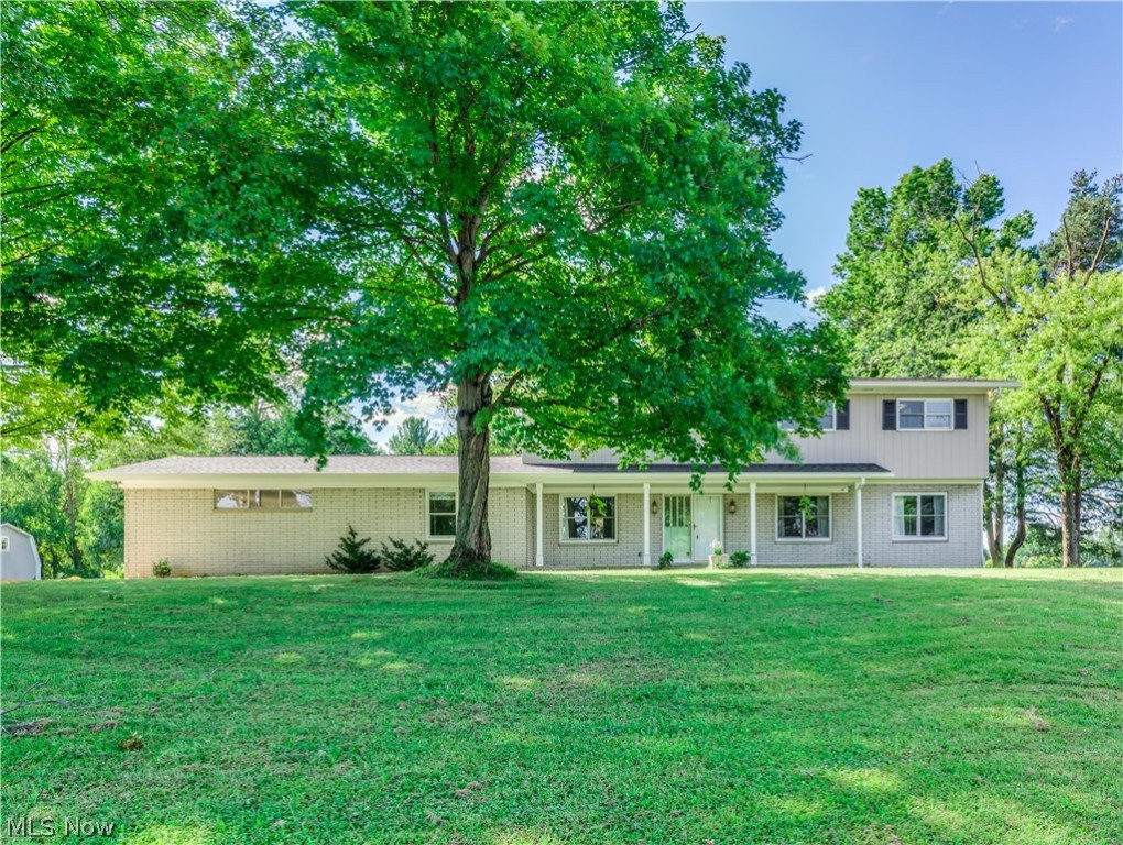 Don't miss this 5 BR 4.5 BA Bath home on 3.62 acres with a brand new kitchen, new septic, outbuilding & more! Slate tile foyer leads to large living room with hardwood floors & woodburning FP. Dining room w HW floors, new paint, built-in cabinet & leads to the office connected to back hallway half bath (could be 6th BR). Brand new wood cabinets, quartz c-tops, slate tile backsplash, pantry cabinet, black s/s appliances, recessed lighting & stylish vinyl flooring.  Family room off of kitchen features brand new carpet, wood burning FP w wood mantle & built-ins. Sunroom off of family rm will feature brand new Pella windows (to be installed in a few weeks), a wet bar & leads to enclosed 3 season rm on deck w brand new windows ('20, $16k investment), new patio door & deck flooring. Convenient laundry rm rounds out spacious 1st flr. Upstairs find 5 BRs & newer carpet. This home has 2 master suites. 1st master feat. 4 brand new Pella windows on the west side of the room & en suite full BA w n