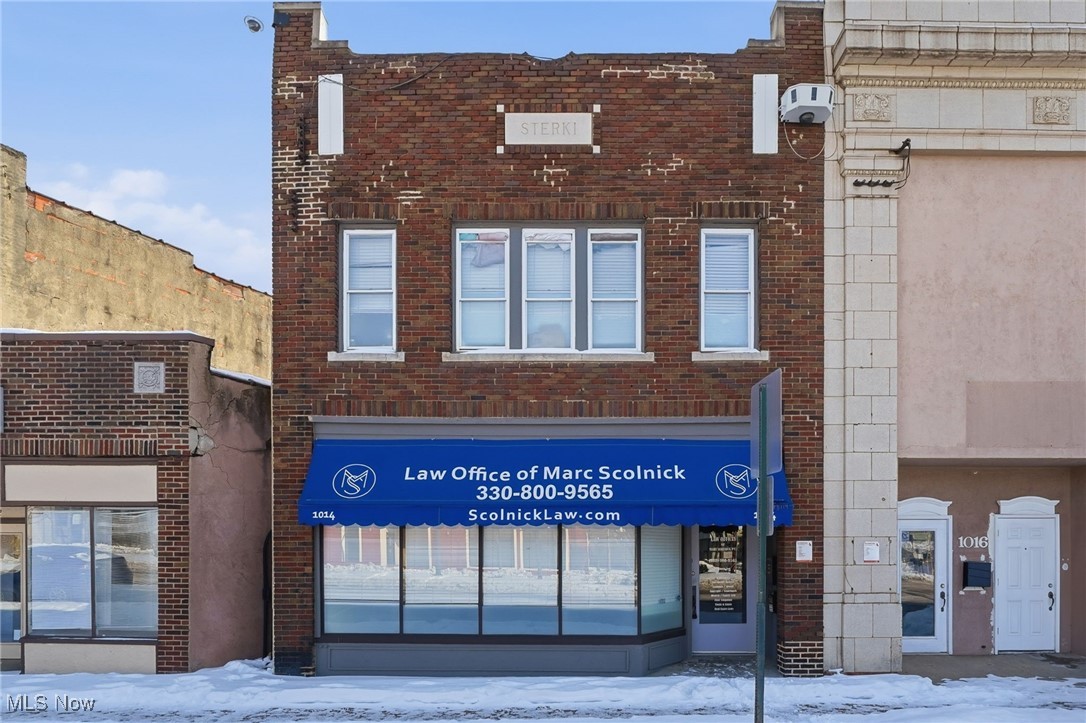 Prime mixed-use commercial property located at 1014 Kenmore Blvd, Akron, OH. This versatile building features an updated street-level retail space with excellent visibility and foot traffic along a well-traveled corridor, plus a finished basement ideal for additional business use, storage, or office space. The second floor offers a 2-bedroom, 1-bath residential unit currently rented for $850/month, providing immediate rental income. Ample rear parking for 6+ vehicles adds convenience for both customers and tenants. Separate uses make this an ideal opportunity for an owner-occupant or investor seeking steady cash flow. Convenient location near local businesses, public transit, and neighborhood amenities. Great value-add potential in a growing commercial area.