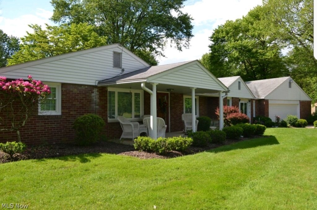 Beautifully cared for brick ranch on private 7.4 acres* A rare find in City of Green* This one owner home offers 3 bedrooms, approx. 1961SF, 2 fireplaces, updated bathroom & updated windows (2011)* Family room with built in cabinets, desk & gas log fireplace with remote* Formal dining room* Living room with wood burning fireplace* Eat in applianced kitchen  with refrig, range, dishwasher & microwave* 1st floor laundry* Mud room* Covered front porch* Oversized attached 2 car (approx. 26x29)* 1300SF pole building with concrete floor* Acreage is wooded; approx. 470x812* Park like setting on dead end street* Building limitations* Home warranty provided*