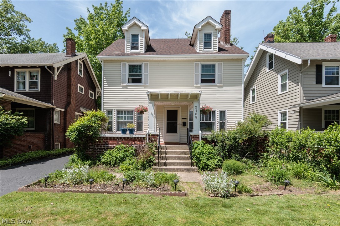 Welcome to 2168 Cottage Grove — a classic Cleveland Heights colonial that has been lovingly owned by the same family for the last 33 years. Filled with charm, character, and functional living space, this home is perfectly situated in a convenient neighborhood within walking distance to restaurants, shops, schools, playgrounds, and more. Cottage Grove is centrally located and connects so many great Heights neighborhoods. It also offers easy driving access to the Cleveland Clinic, UH, Case Western Reserve and downtown.
This spacious 5-bedroom, 2 full-bath home offers flexibility for a wide range of buyers with over 2,000 square feet. The first floor features a welcoming living room, bright sunroom, spacious dining room, and a highly functional kitchen layout. Hardwood floors throughout provide the timeless warmth and classic charm Cleveland Heights homes are known for. Upstairs, you’ll find an open landing surrounded by four generously sized bedrooms and a full bath. The third floor adds even more versatile living space with an additional bedroom, full bath, and bonus area perfect for entertaining, relaxing, a home office, or guest suite. The unfinished basement provides excellent storage space along with room for tools, laundry, hobbies, or future possibilities. Outside, enjoy wonderful usable outdoor space including a welcoming front porch, beautiful gardens, and a deep backyard ideal for entertaining, play, or relaxing evenings at home. Don’t miss your opportunity to own this classic Heights home — schedule your showing today!