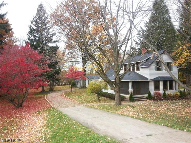 Over the hill and thru the woods!!  Absolutely lovely, right out of a Currier & Ives painting, this picturesque century home is situated on a nearly one-acre wooded lot, offering an amazing country oasis in Westlake, but just 2 minutes from Crocker Park and all conveniences!  This lovingly renovated 2-story home has just been remodeled to add modern function, yet restore its original charm!  Wonderful curb appeal and a great garage/barn 27 x 25 with loft is ideal for hobbyist or extra storage. Gleaming hardwood floors, gorgeous trim, beveled glass doors, cozy screened porch, lots of windows allowing natural light.  Inviting gathering room kitchen with handy center island is a great spot for culinary creativity and mealtime get-togethers, boasting built-in appliances, loads of solid cabinetry & counter space!  A fabulous breakfast bar w/ granite counter doubles as extra dining area and makes a great serving counter when entertaining, open to the impressive formal dining room, and the ad