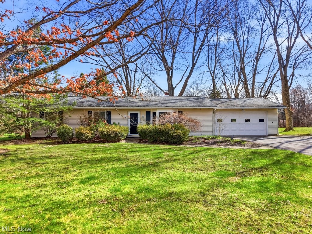 Welcome home to a private one-acre beauty, with the sights and sounds of Mother Nature, perfectly timed to embrace the upcoming spring and prepare for a summer filled with sun and backyard BBQs. This charming 3-bedroom, 2-bath ranch offers a bright and airy atmosphere, highlighted by a beautiful bay window and plenty of natural sunlight throughout. The bedrooms have spacious closets and the primary suite has a private full bathroom.  Designed for easy living, this home has a functional no-basement layout, GREAT kitchen with plenty of cabinet space, walk-in pantry and a kitchen-integrated laundry area for maximum convenience. Step outside to find the patio area, perfect for that morning cup of coffee and al fresco dining. The green space gives you ample room to host gatherings, tend to a few chickens, or plant a massive vegetable garden. The potential to continue building out on this property is the ultimate canvas for your outdoor lifestyle. This home has a 2-car garage with convenient overhead attic storage and a shed.
Chagrin Falls with captivating natural waterfalls, its enchanting downtown, Chagrin Falls award-winning schools and nearby Cleveland Metroparks is a relaxed yet engaging lifestyle. A village where neighbors connect, community spirit thrives and is truly a place to call home. Everyone has a story...begin yours here~