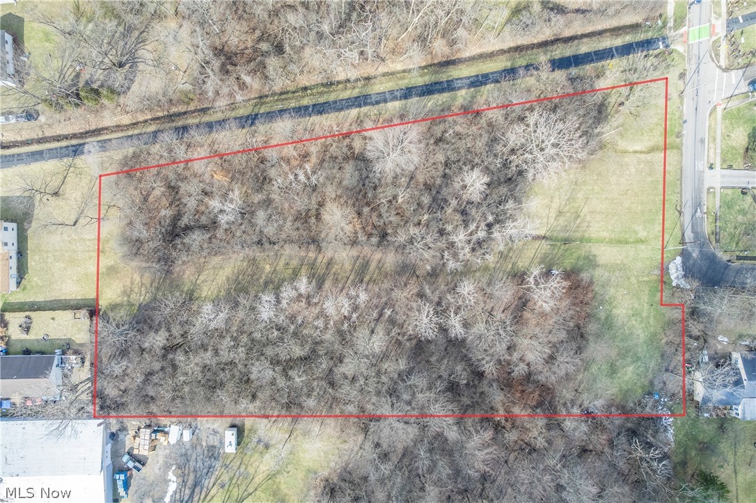 Superb Opportunity! Location, Location! Rare 2.6 approx-acre partially treed lot in the heart of downtown Oberlin, perfectly positioned next to the bike path and just a short walk to shops, dining, and campus. Zoned R-1B for single-family use, this property offers the ideal setting to build your dream home while enjoying privacy and room to breathe. Imagine space for gardens, outdoor entertaining, or simply enjoying nature — all while being minutes from major highways, shopping, and everything vibrant Oberlin has to offer. A truly special chance to create something extraordinary in an unbeatable location. Utilities at the street. Property could possibly be rezoned to add commercial...please contact the city.