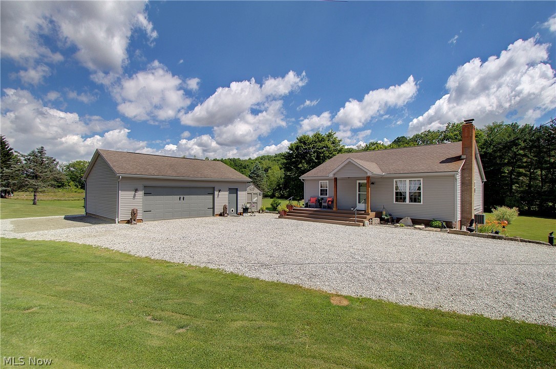 Enjoy peaceful country living in this beautifully maintained ranch home situated on 2.25 acres. Once you step inside you will notice an inviting open concept with the kitchen, living room and dining area flowing nicely together. Two bedrooms, a full bath, and convenient main level laundry complete the first floor. Step outside to the covered rear deck and take in the stunning views of the surrounding nature. The walk out lower level offers a spacious area with a wood burning fireplace, full bath and the potential for a third bedroom. Additional features include a concrete patio, two storage sheds and a spacious two car garage with electric. This home is truly move in ready and full of country charm just waiting for its next owner. Contact me today for a private showing.