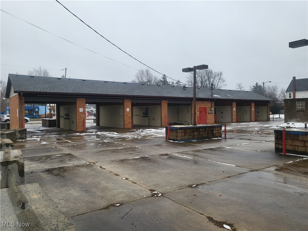 Exceptional commercial corner lot featuring both south and north entrances, offering convenient dual access and excellent visibility. Located in the heart of downtown Elyria, this high-exposure property benefits from strong foot traffic, close proximity to schools, and a high daily traffic count. Formerly operated as a car wash, the property includes multiple bays and an attached utility/office area, providing flexible redevelopment or business-use potential. Ideal for investors, owner-operators, or developers seeking a strategic location with built-in infrastructure and accessibility. A rare opportunity in a thriving downtown corridor. Drive by TODAY!
