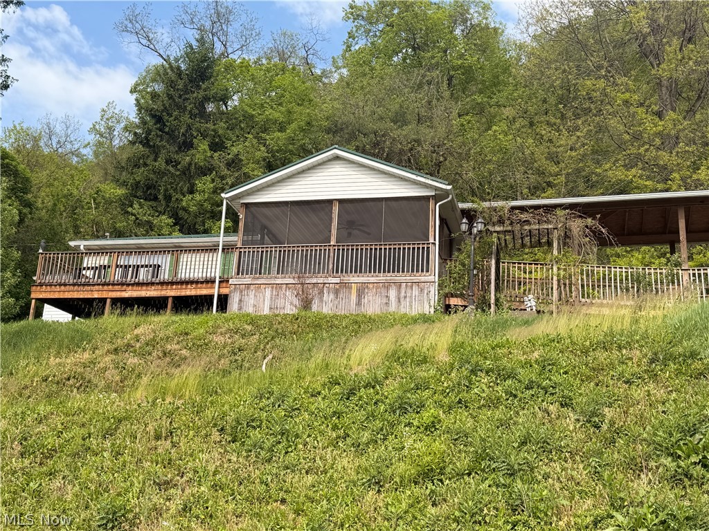 Looking for a ranch style home? Here you go, three bedrooms, eat in kitchen, living with big window to enjoy the view, two full bathrooms, the bathroom off the primary bedroom is handicap accessible. The full-size basement offers the laundry area and room that if you use it for what like. The property is handicap accessible with a screen in porch on the front and a deck off the primary bathroom, a patio area to enjoy your day and also a two-car garage.