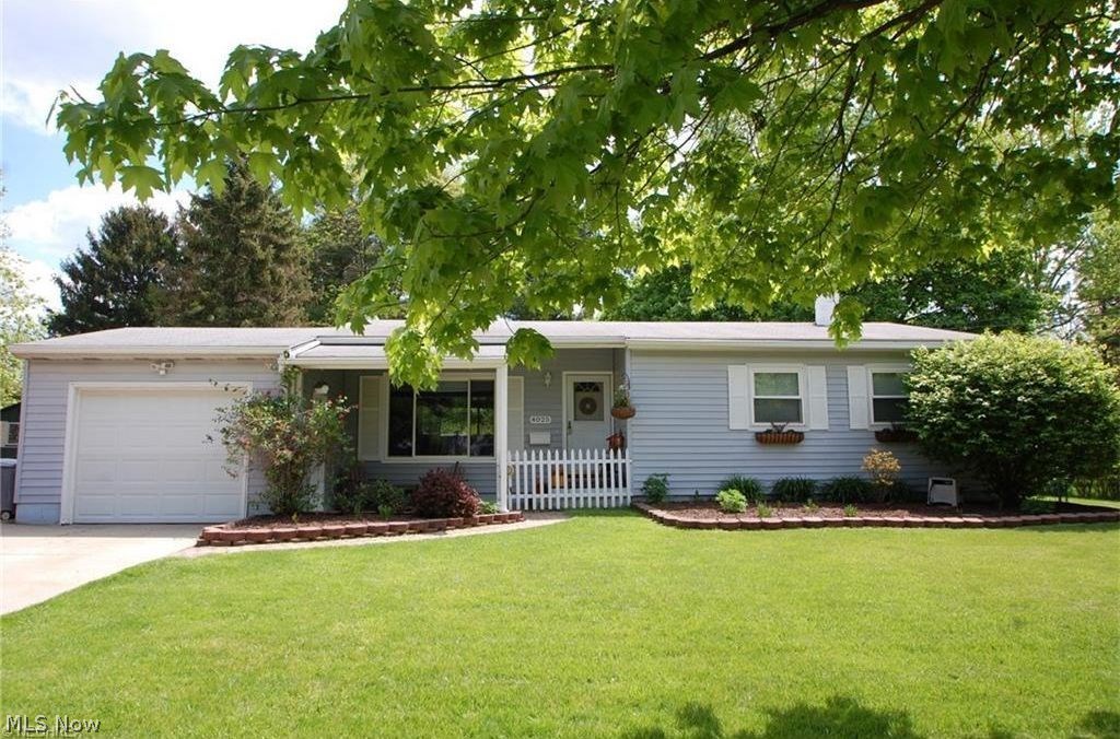 An exceptional 3 bedroom, 2 bath ranch with a finished basement.  This lovely home has a completely fenced/private back yard with an all brick patio and a hot tub.   Vaulted ceilings highlight the large living room that connects to the dining room.  There is an attached garage, front porch, new hot water tank, updated windows, laundry room, and so much more.
