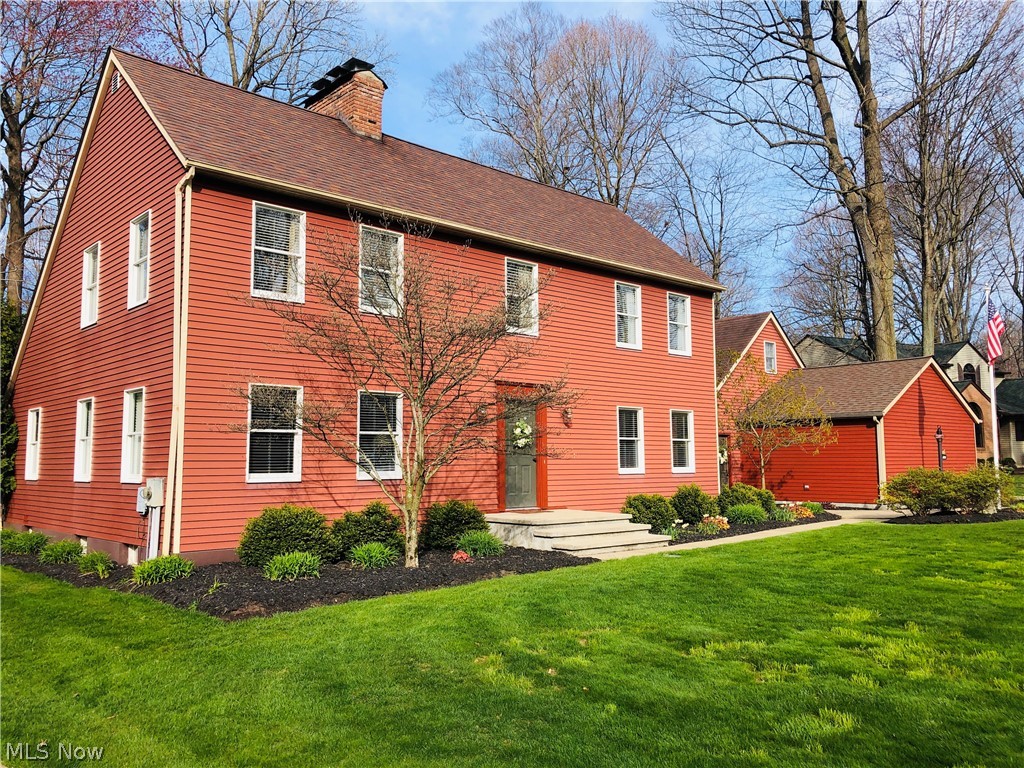 The home for which the neighborhood was built. This custom Saltbox, classic American Colonial architectural from the 1600s, remains a popular standard in New England. From the open fireplaces to peg-head Early American stained hard oak floors, it is authentic in style and feature. An original early American farmhouse. Entry foyer hosts 2 double closets, flanked by the office and family room. Dining hall with soaring vaulted ceiling and adjacent kitchen are open-concept, magnificently positioned as the heart of this home - and with a hearth. Blending elements of hewn beams and brick walls, this kitchen has a vintage farmhouse sink, and is upgraded with a Viking gas cook-top positioned in the spansive island. Plentiful cabinetry and large pantry accommodate this gourmet center. A wall of windows in the sun room looks out to patio, gardens, and forest. The Master quarters offers 3 double closets, crown molding and open fireplace, with double vanity and custom shower en suite. Two addition