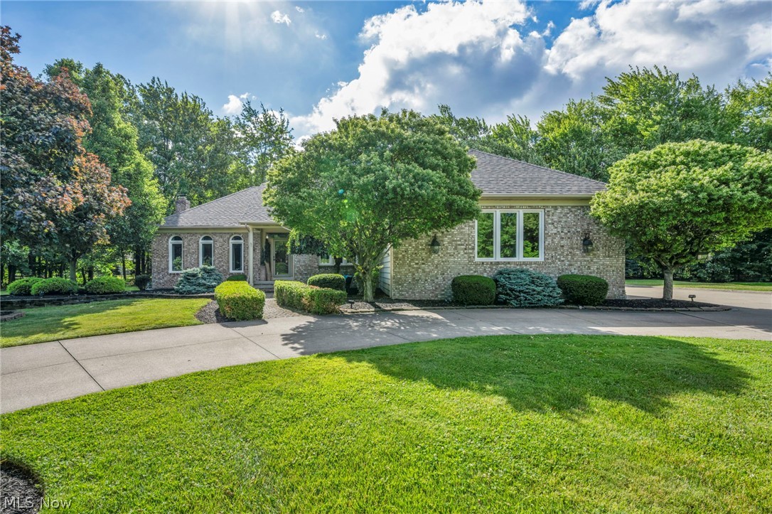 Welcome to this stunning custom-built contemporary home by M.W. Miozzi Homes, tucked away on a quiet cul-de-sac in sought-after Aberdeen West. The main level features an owner's suite with an ADA-accessible bath, first-floor laundry, private office, formal dining room, and a spacious living room with a fireplace. The updated eat-in kitchen with granite countertops opens to a beautiful three-season room and large deck overlooking the private, wooded backyard.

Upstairs, you'll find a luxurious primary suite with a jetted tub, separate shower, dual vanities, and dual walk-in closets, plus an additional bedroom and full bath. The finished walk-out lower level offers a fourth bedroom, full bath, and plenty of space for entertaining, recreation, or a home gym.

Additional highlights include a spacious three-car garage with a recently built workshop and a sprinkler system. Major updates include the roof (2020), gutters (2023), furnace and A/C (2025), lifetime warranty windows and sliding door (2022), carpet (2024), basement (2024), Laundry room (2024) (list of all additional updates and appliances at the home) 

Conveniently located minutes from I-271, I-90, medical centers, shopping, dining, and schools, this move-in-ready home offers space, privacy, and exceptional updates throughout.
