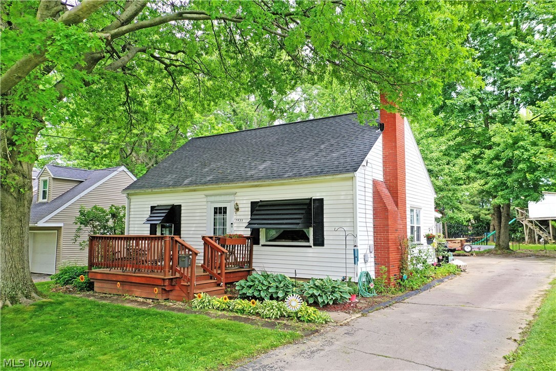 Your home for the summer and more just arrived today! This darling Boardman Cape Cod is brimming with style and potential alike as it presents a variety of highly desirable qualities both inside and out. The prime location residence finds itself in a quiet neighborhood, just moments away from some of the area’s premiere shopping and dining districts. Veiled in the natural privacy of tall trees, the charmer peers out to present its impressive, raised front patio area; a perfect place for warm weather relaxation. The cement driveway wraps around to find both a window lined rear sunroom and an oversized, two-car garage for secure storage. Further into the yard, a fenced-in area finds a child friendly treehouse. Meanwhile, find your green thumb within the grow-ready greenhouse and accompanying outdoor garden area. Through the front door, a welcoming living room brings you inside, setting the tone for comfort. Around the corner, find the window lined dining space that transitions into the gracious kitchen with its bright white appliances and tiled backsplash. Completing the first floor, a pair of spacious bedrooms join a brightly lit full bath. Upstairs, the landing splits off to find a large storage area; an easy nursery or office space. The third, loft bedroom opens to reveal its sizeable footprint, completing the floor. Laundry and storage are found at the basement level.
