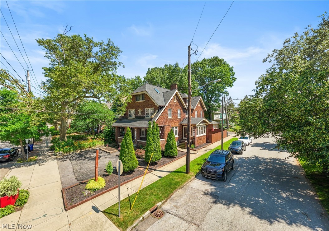 Welcome to 12404 Larchmere Avenue—a rare, all-brick duplex on a prominent corner lot in the heart of Cleveland’s vibrant and historic Larchmere District. This exceptional property blends classic architectural charm with modern updates and proven income potential, currently operating as a fully functional Airbnb.

The spacious front unit offers four generously sized bedrooms, a beautifully updated kitchen with granite countertops and upgraded appliances, and timeless character showcased through original built-ins and expansive windows that flood the home with natural light. Enjoy relaxing mornings or evenings on the covered front porch. The basement adds even more flexibility with a full bathroom and additional usable space, while convenient front parking enhances accessibility.

The rear unit features its own private entrance and a thoughtfully designed layout, including an updated kitchen, living room, and dining room. Upstairs, the primary bedroom opens to a private balcony, complemented by an additional bedroom. The walkout basement expands the living possibilities with a bedroom and kitchenette—ideal for guests or extended stays. Step outside to enjoy the attached deck, perfect for entertaining or quiet relaxation.

The property also includes an deattached garage and a backyard retreat with an additional outdoor living space, offering multiple areas to unwind or host. Located just steps from the shops, restaurants, and cultural charm of Larchmere, and minutes from Shaker Square, this property offers unmatched convenience. World-class healthcare at Cleveland Clinic and University Hospitals is just a short 5-minute drive away.  Whether you’re an investor seeking strong short-term rental income or an owner-occupant looking for versatility and location, this unique duplex delivers opportunity, character, and lifestyle all in one. Furniture is negotiable.  Schedule showings around bookings.