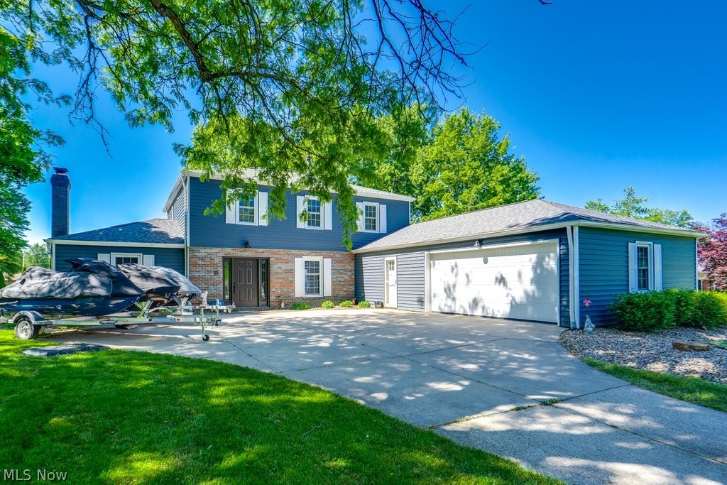 Welcome to 339 S Park Drive, a beautifully updated 4-bed, 2.5-bath colonial located in Aurora's highly sought-after Four Seasons community. Combining spacious living areas, modern updates, and outstanding neighborhood amenities, this move-in-ready home offers the lifestyle today's buyers are searching for.

Step inside to discover a thoughtfully designed floor plan featuring updated flooring, neutral décor, and multiple spaces for living, working, and entertaining. The remodeled kitchen serves as the heart of the home with abundant cabinetry, modern countertops, stainless steel appliances, and an adjoining breakfast nook. The formal dining room is perfect for gatherings, while the spacious living room provides additional room to relax and entertain.

The impressive family room features vaulted ceilings with exposed beams, a stunning brick fireplace, and access to the backyard patio. A versatile main-floor flex room offers endless possibilities as a home office, playroom, fitness room, or hobby space. An updated half bath completes the first floor.

Upstairs, you'll find four generously sized bedrooms, including a spacious primary suite with an updated private bath and walk-in closet. The additional bedrooms provide plenty of room for family, guests, or remote work, while the updated full bath serves the secondary bedrooms.

Outside, enjoy the expansive backyard with mature trees, patio space, fire pit area, storage shed, and plenty of room for outdoor activities. The oversized lot offers both privacy and space rarely found in neighborhood settings.

Residents of Four Seasons enjoy resort-style amenities including playground, community events, and a private lake with beach access. Located within the award-winning Aurora City School District and just minutes from shopping, dining, parks, and golf courses, this home truly offers the best of Aurora living.

Move right in and start enjoying everything this exceptional home and community have to offer.