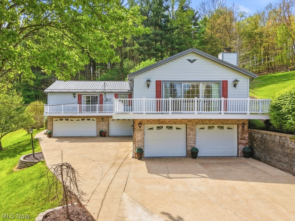Welcome to your dream home at Lake Mohawk! This one is packed with charm, space, and thoughtful updates throughout. Featuring 4 spacious bedrooms—including a private ensuite—and a total of 3 full bathrooms, there’s room for everyone to spread out and feel at home. The oversized 5-car garage is a rare find and perfect for hobbyists, lake toys, or extra storage. The inviting living room offers beautiful lake views and a cozy gas fireplace—perfect for relaxing year-round. The updated kitchen shines with granite countertops and flows seamlessly into a large dining room, making it ideal for entertaining. A cozy den just off the kitchen adds even more living space and leads to a covered back patio—also accessible from the primary bedroom for a peaceful retreat. You’ll love the character throughout, enhanced by thoughtfully placed skylights that fill the home with natural light. Step outside to enjoy the expansive wraparound wood deck, perfect for taking in the surroundings. The backyard truly feels like an escape—featuring a heated pool, composite deck area, and storage shed, all set in an enchanting, private setting. Additional updates include a whole house generator, newer sump pump, water softener, and hot water heater (2025)—offering peace of mind for years to come. As part of the Lake Mohawk community, enjoy amenities of a private lake with unlimited horsepower boating, beaches, clubhouse, golf course, pickle ball/tennis courts, and a vibrant calendar of social events. Don’t miss your chance to own this one-of-a-kind property—it’s truly a gem!