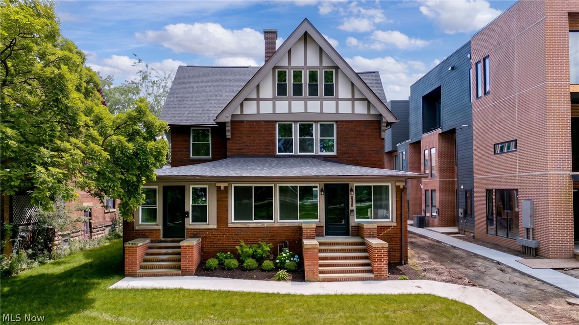 Move in Ready! Welcome to the crown jewel of an exciting new Edgewater community — a stunning Tudor resurrection on one of Cleveland's most iconic streets. Part of an exciting new community of townhomes and rehabbed historic homes on one of Cleveland's most beloved streets, this masterfully restored side-by-side home delivers luxury finishes while honoring its historic character. Original hardwoods, preserved millwork, and a layout that simply doesn't exist in anything built today.
The main level features a sunroom, grand living and dining rooms, a reading parlor, rehabbed kitchen with stainless steel appliances, and a mudroom to contain any chaos. Upstairs, the primary suite is a true sanctuary — a massive wet room with soaking tub, walk-in shower, and natural stone tile that rivals any boutique hotel. A second spacious bedroom and full bath complete this floor. Head up to the third floor and you'll find three more generous bedrooms and another full bath — room for everyone and everything. Huge basement, back porch, and garage round it out — with lake views that never get old.
At 5 bedrooms and 3.5 baths across three floors, this home lives exactly like a single family home — without any of the hassle. The HOA covers exterior maintenance, landscaping, and snow removal, so you get all the space and character without lifting a finger on weekends. Walk to Edgewater Park and some of the West Side's best dining and nightlife right outside your door. Minutes to Downtown Cleveland and I-90. The 15-year tax abatement makes this as fiscally smart as it is beautiful. More photos to follow - estimated ready for move-in May 2026
