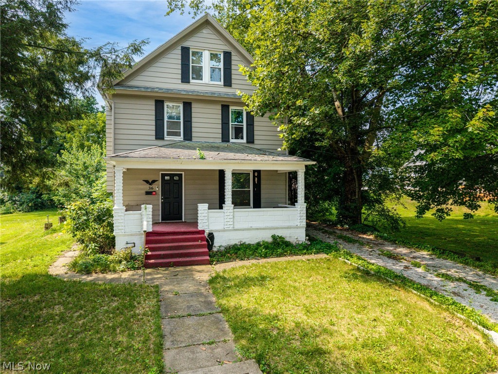 Step into timeless charm with this beautifully maintained 1912 home, where stunning original woodwork and classic architectural details blend seamlessly with modern updates. The inviting living room features a cozy wood-burning fireplace and elegant double wooden pocket doors, creating the perfect space for relaxing or entertaining. The spacious kitchen is a chef’s dream, offering an abundance of cabinetry, generous counter space, and convenient main-level laundry. Luxury vinyl plank flooring adds durability and style throughout much of the home. Upstairs, you’ll find a spacious primary bedroom featuring an incredible five closets for exceptional storage, along with two additional bedrooms and two deep hallway closets on either side of the staircase. A unique secondary staircase from the kitchen provides private access to the primary bedroom. The finished third floor offers a fourth bedroom plus three additional storage areas, making it ideal for guests, a home office, hobby space, or a private retreat. Outside, enjoy the fully fenced backyard, a spacious deck perfect for summer gatherings, and a two-car detached garage. Major mechanical updates provide peace of mind, including a new furnace and central air conditioning (2021), water heater (2021), and newer windows throughout. Rich in character and loaded with space, storage, and thoughtful updates, this one-of-a-kind home offers the perfect blend of historic elegance and modern convenience. Schedule your private showing today