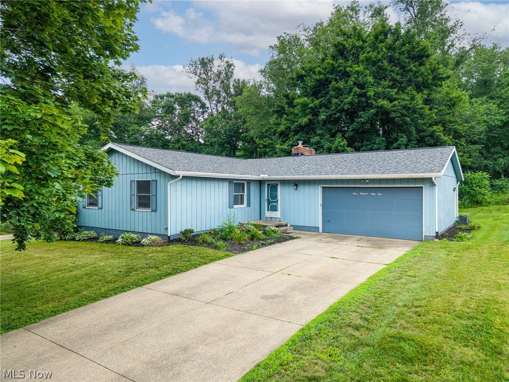 Welcome to 364 Garner Road in Mogadore! This charming ranch-style home offers a wonderful opportunity to create the home you've always envisioned. Featuring 3 bedrooms and 3 full bathrooms, this home provides comfortable one-floor living with plenty of space to make it your own. With good bones and endless potential, it's the perfect canvas for a new owner to add their personal style and updates.

The functional floor plan is complemented by an attached two and a half car garage which includes additional workspace, offering convenience and ample storage. Outside, you'll appreciate the spacious yard with a peaceful wooded backdrop, providing both privacy and room to relax, entertain, or enjoy nature. The long driveway welcomes you home and adds to the property's curb appeal.

Enjoy added peace of mind with several major updates, including a new roof installed in May 2023, new gutters with gutter guards installed in 2022, and an updated electrical panel installed in the spring of 2026. The basement is partially finished with the option to add in a kitchenette or additional bathroom with the water and drain hookups and a 220V outlet already installed. 

Whether you're a first-time buyer, downsizing, or looking for a home with endless potential, this property is ready for its next chapter. Bring your ideas and make 364 Garner Road your own!
