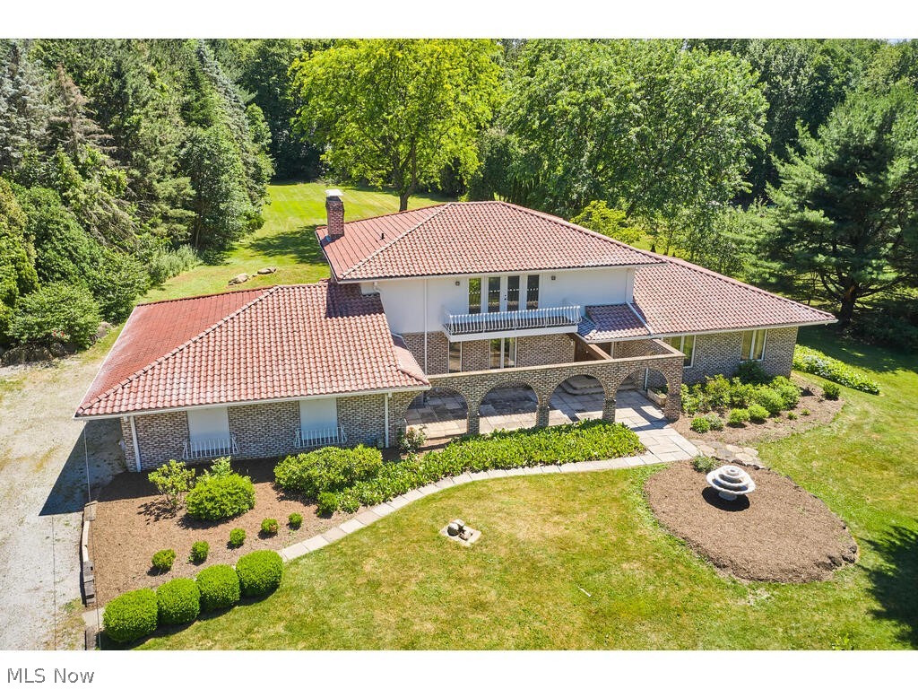 This 3 Bedroom, 3.5 bath home w/walkout lower level is situated on 1.72 private acres in the Rolling Retreat neighborhood in Bath Township. Revere Schools.
The kitchen is the center of the home and features a Viking Refrigerator, double ovens, and granite countertops. Kitchen opens to the family room w/fireplace and French doors to a beautiful brick patio w/large, flat backyard. Don't miss the front stone patio w/brick arches! Living room, office, formal dining room, laundry room & 1 full bath complete the main level. 2nd floor features owner's suite w/private balcony and newly renovated owner's bath plus 2 additional bedrooms & 1 full bath. Walkout Lower Level features a large rec room, other finished space & half bath. 3-car garage.
