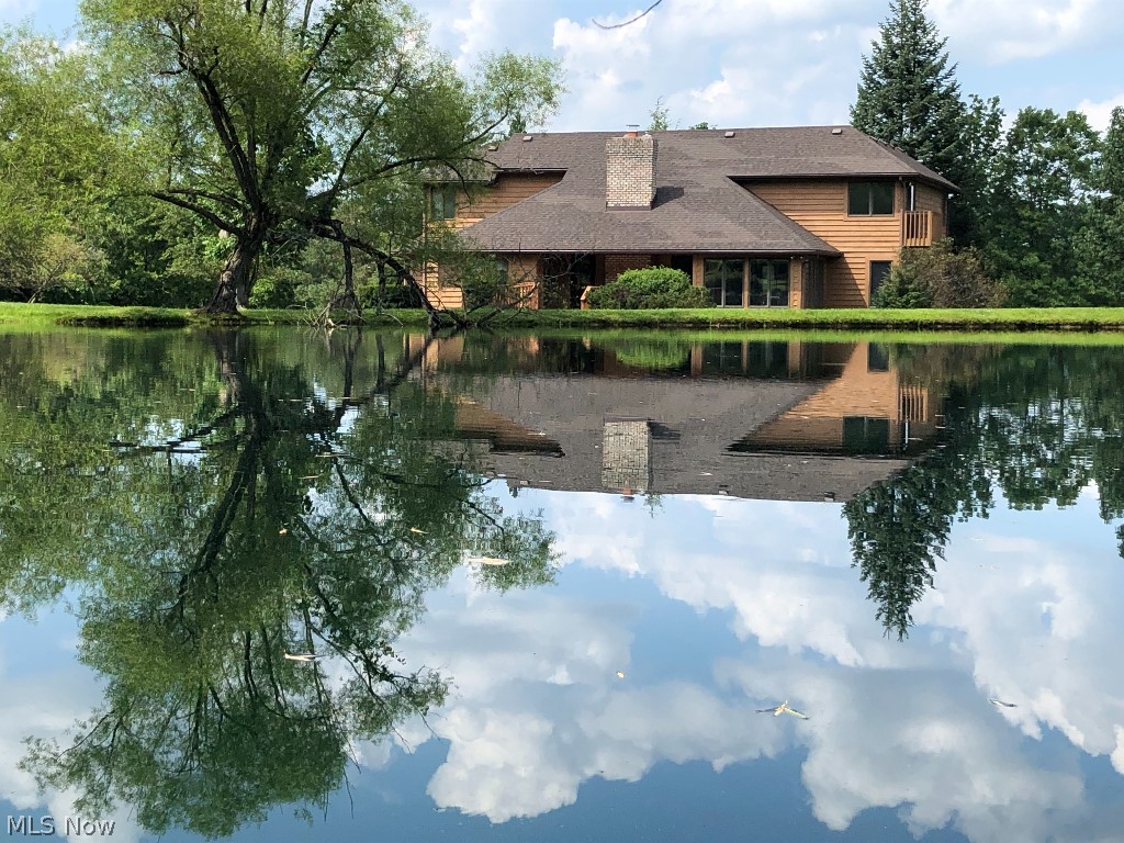 Stunning Architect Designed Custom Built 5 Bedrm Home situated on just under 10 breathtaking acres in desirable Montville Township.RARE OPPORTUNITY for a PRIVATE ESTATE close to Medina with great I-71/271/18 access w/PUBLIC WATER and NO CITY TAX!   Two owners since new and meticulously maintained.  This Custom Home offers * Great Room w/Cathedral Ceiling, Luxury Insert Fireplace *Custom solid wood cherry cabinets throughout *2 Story Foyer flanked by the clean lines of an open staircase *Living Rm/Morning Rm *Formal Dining Rm *Large Custom Eat-In Kitchen opens to the Great Rm *Butler's Pantry/Mudrm *1st FLR Laundry *Huge Private Primary Suite with adjoining Sun Rm, Bath with Garden Soaking Tub and Separate Shower and a Huge Walk-in Closet with Built IN *The 1st FLR is completed by an additional Bedroom and Guest Ba *Upstairs 3 additional Spacious Bedrms with Large Full Ba *Quality 2 x 6 Construction *Natural Gas Heat *Huge 2,260 sq. ft unfinished Basement fully plumbed, for work space, storage or finish for potential 5,557 sq. ft Living Space *Freshly Stained House/Barn *Roof ('17) *HWT ('17) *AC ('22) *Newer Garage Door/Andersen Exterior Doors *Washer/Dryer ('24) *Cooktop ('25) *Newer Furnace/High-end Stainless Steel Appliances *Beautiful Stocked Pond *Custom 40 x 42 Barn ('15) - w/Concrete Floor & Full Electric *Orchard *Large Entertainment Deck *Split Rail Fencing *Full Property Access by maintained Walking Trail