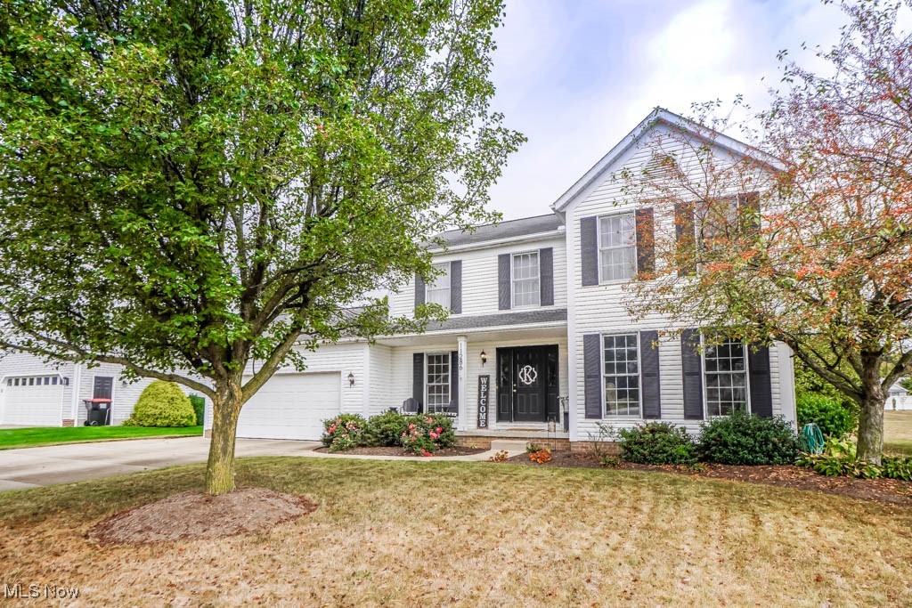 This one-owner colonial in Hoover Estates offers a warm, inviting feel from the moment you walk in. The formal living and dining rooms frame the entry, leading to a kitchen with ample cabinet space, a breakfast bar, and casual dining that opens to the family room, where a stone fireplace adds a cozy touch. A guest bath and laundry room just inside the attached two-car garage complete the main level. Upstairs, you'll find 4 spacious bedrooms and 2 full baths, including a primary suite with vaulted ceilings, a walk-in closet, and an en suite featuring double sinks, a soaking tub, and step-in shower. Outside, enjoy the covered porch or host gatherings on the deck and patio in the tree-lined backyard. With newer carpeting and a great location in the Lake School District, this beautiful home is ready for its next chapter. Schedule your showing today!