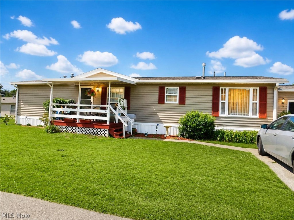 A maintained, move-in ready residence offering 1,500+ square feet of comfortable one-floor living in a peaceful 55+ community. This  home features 3 bedrooms and 2 full bathrooms, including a generous primary suite with a private bath boasting double sinks and two separate showers for added convenience. The inviting living room is highlighted by a cozy stone gas fireplace, creating the perfect space to relax or entertain. Enjoy peace of mind with a 1-year-old roof and new exterior ductwork. All kitchen appliances, along with the washer and dryer, are included, making your move even easier. Outside you will appreciate the freshly painted covered front porch. This is the only unit in the park with an attached garage with power and also has an attic for extra storage. Concrete driveway as well. Residents can also take advantage of the community's outdoor common area, ideal for gatherings, celebrations, and spending time with neighbors. Don't miss this opportunity to own a well-appointed, move-in ready home in a quiet and welcoming community that's ready for its new owners!
**Some photos AI enhanced