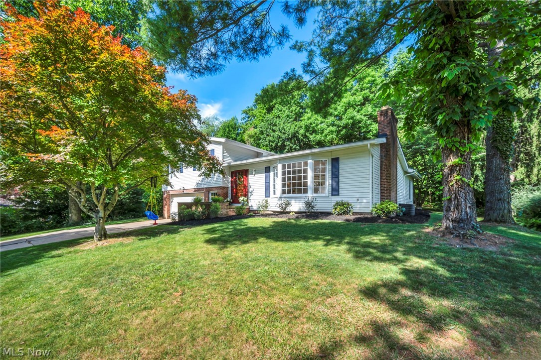 Updated and remodeled brick and vinyl 4-Level Split on a quiet .78-acre cul-de-sac lot. Welcoming foyer entry with
wood engineered floors throughout the main level, open style floor plan for easy living and entertaining. Living room
with attractive fireplace and bayed window area. Centrally located dining room accommodates a large table for
holiday dinners. Great kitchen offering Amish custom built cabinets, quartz counter tops, tile backsplash, walk in
pantry, Center island with 3 pendant lights, all stainless appliances stay which includes fridge with built in Keurig
coffee feature and a convenient breakfast bar. Vaulted great room, white washed cedar ceiling with beams. Stone
fireplace highlights the room with new gas insert, beverage/ bar station, built in Johnny's on Fulton wine rack, ceiling
fan, natural lighting and sliding doors to a 25' paver patio. The half bath offers a marble vanity and green house
window. Upper level boasts hardwood flooring- Master suite has a private ensuite bath with double sinks and walk in
shower, 2 more bedrooms plus a hall bathroom with tub. Five steps down from the main level is a laundry room with
washer and dryer, mud room entry area from the 2-car garage and a fourth bedroom perfect for a teen, office or
guest suite. The lower fourth level offers an unfinished 27' clean basement with many possibilities, stationary tub,
new sump pump in 2024 and glass block windows, Attached garage with side area for your extra fridge and yard
tools. New roof in 2018. You will love the lot (it goes 10 feet into the woods)and quietness of the dead end street but
have the quick convenience of shops and restaurants minutes away in downtown Brecksville plus close access to Rt
82 and 77. 12-month home warranty.