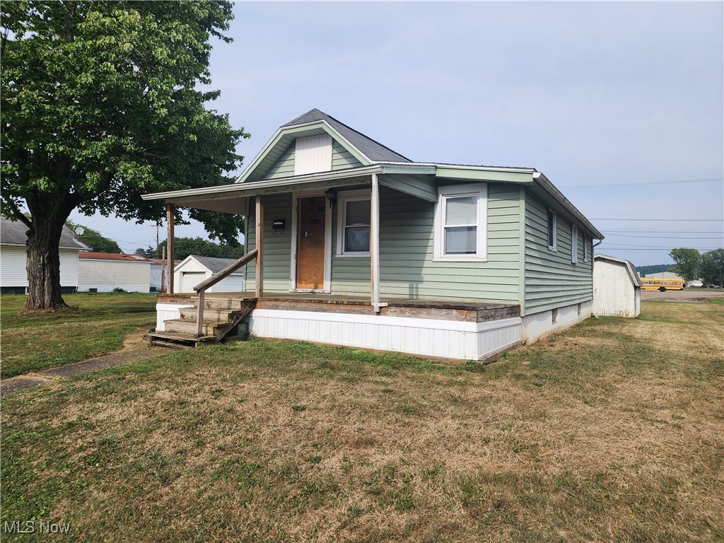 Don't miss this affordable turn-key home in Newcomerstown! The main level features a nice living room, kitchen with new counters, 2 bedrooms including a walk-in closet, possible 3rd bedroom or office space, and full bathroom. The lower level walk-out basement offers laundry space and ample storage. Spacious backyard with storage shed. Walking distance to Newcomerstown schools. Updated paint and flooring throughout. If you are looking for an adorable starter home or wanting to downsize this cozy ranch home will be perfect for you! Call today for a private tour!
