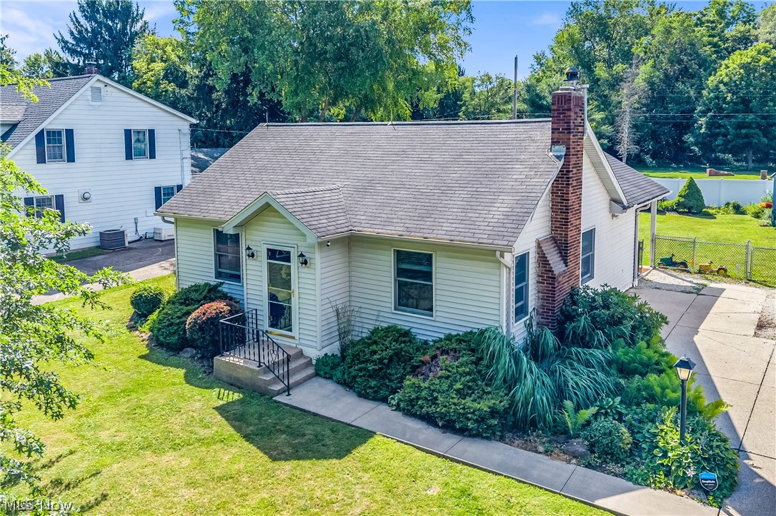 Welcome to 1372 Earhart Ave! Don’t let this little ranch fool you! It was completely gutted down to the studs in 2002, with all new doors, windows, roof, siding, HVAC, plumbing and upgraded electrical service, plus a re-design giving it a more open concept feel on the main floor! NOW there is a finished rec room, half bath and office/bedroom with a cedar closet in the basement, along with a beautiful wood-burning stove, blower fand exhaust fan or ambiance and extra warmth in the winter!! The character and charm has been preserved with natural woodwork and solid oak doors throughout the home and a ventless gas fireplace and mantle added to the living room. There are two bedrooms on the main floor, along with a full bath and new carpet added (2021), both upstairs and down. The eat-in kitchen has lovely oak cabinetry, a breakfast bar, lots of counter space, stainless steel appliances and a vaulted ceiling giving it a light, airy feel. There’s also a pantry, plus extra storage in the adjacent mudroom, which is the first stop when you enter the home at the back of the house. There is a 24’x11’ covered patio (with a retractable sunscreen on one side) from which you can see the beautiful fenced-in backyard, where the sellers have invested so much time in gardening and landscaping! The large shed has electric and double lofts for extra storage. I know, there’s no garage, BUT there IS a long concrete driveway in excellent shape and an attached garage would be easy to add, if needed. This home is in the coveted Copley-Fairlawn school district and less than a mile to I77, for easy highway access. Don’t miss out on your chance to own such a beautiful, well-kept home where peace and tranquility reign and your private backyard is a little slice of Eden. See supplements for more details/dates. Call soon to schedule a showing before this one is GONE!
