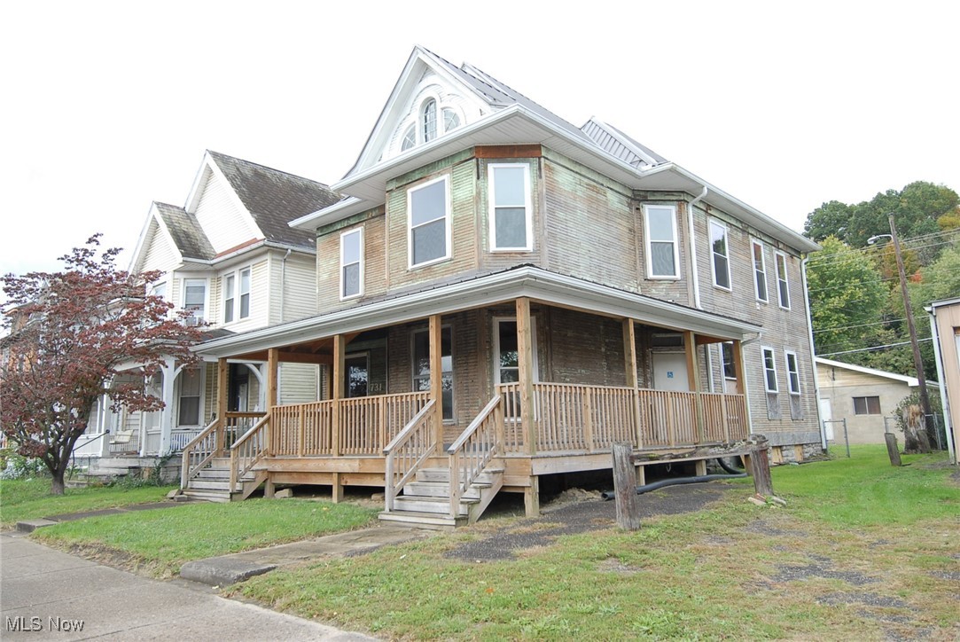 New metal roof in 2020, new wraparound porch along with replacement windows.  Two car block garage with concrete floor.  Interior is unfinished.  Selling in as is condition.  Listing agent has a dower interest and is related to seller.