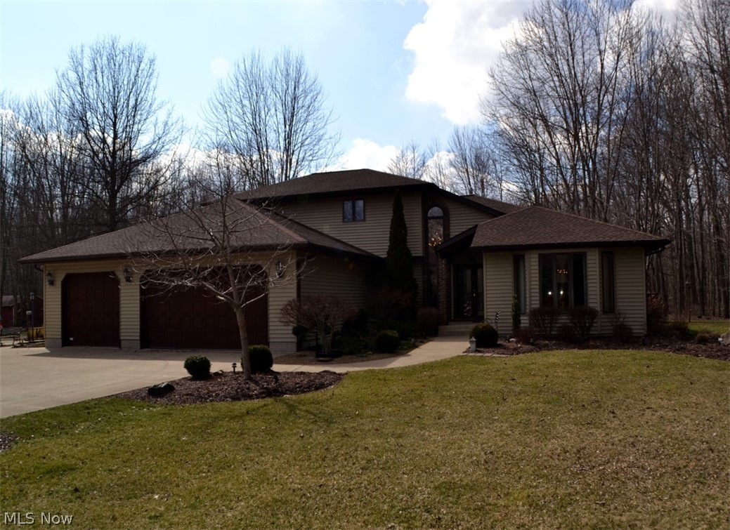 Absolutely stunning custom-built Country home!  Features include cozy family room with wood burning fireplace with gas log starter, formal living and dining rooms, gourmet kitchen with Granite transformation counter tops, snack bar island with Whirlpool gas range, tile back splash, Bosch stainless-steel dishwasher, Kenmore refrigerator, raised panel cabinets, under cabinet lighting, ceiling fan, tile floor plus 11' x 16' dining area with vaulted ceiling, two story foyer with double door entry and hardwood floor, first floor master suite with spacious bedroom, full bath with walk-in dressing room, whirlpool tub, shower stall, tile floor and make-up table, three additional spacious bedrooms, 2.5 baths, convenient first floor laundry room with extra cabinets, laundry tub and folding table. All custom window treatments remain, full basement with Rheem high efficiency gas furnaces, Rheem Central Air conditioner, Aprilaire humidifier, basement "man cave," 16' x 30' basement workshop, loads o